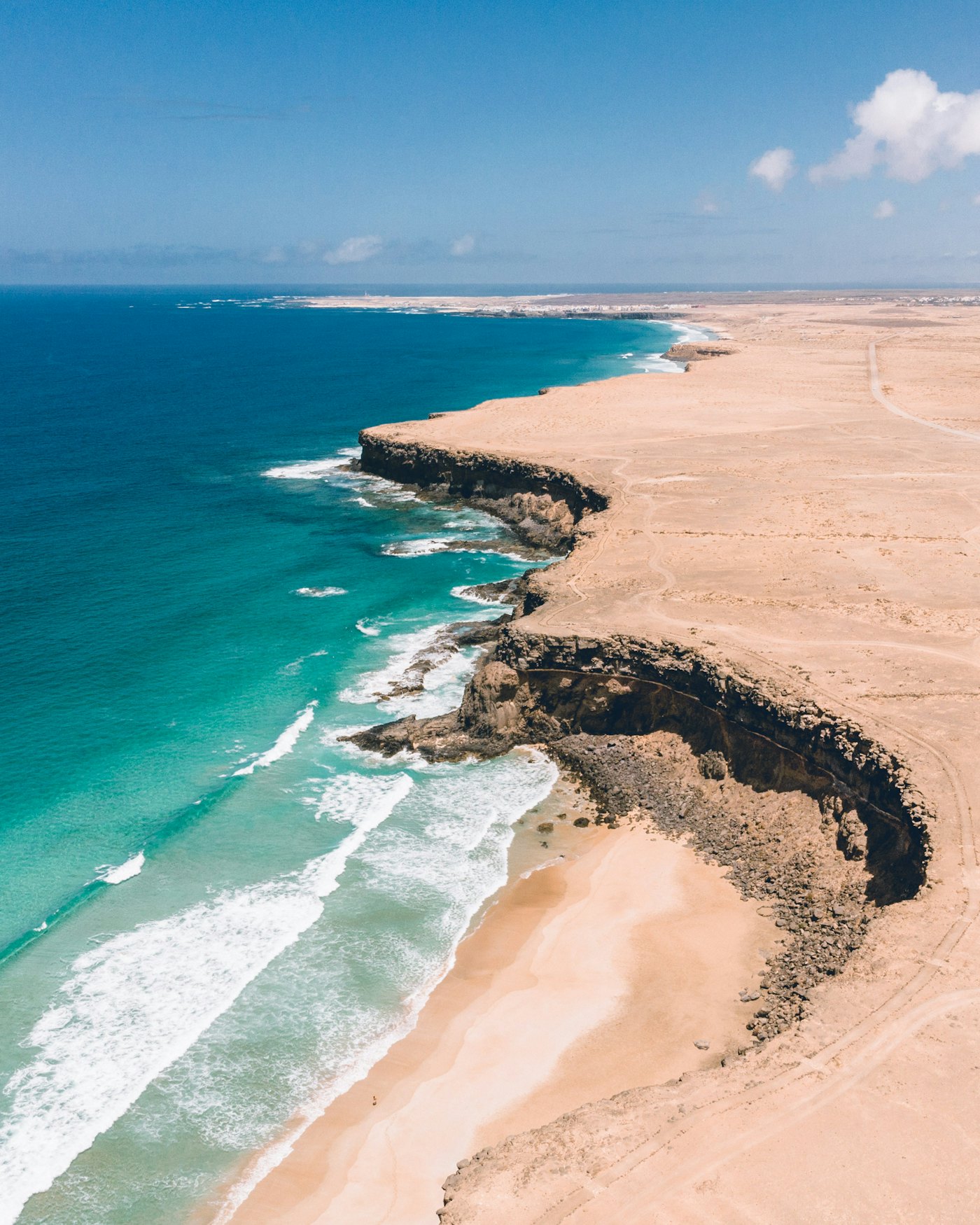 Golden sand and clear water at Playa de la Escalera, Fuerteventura