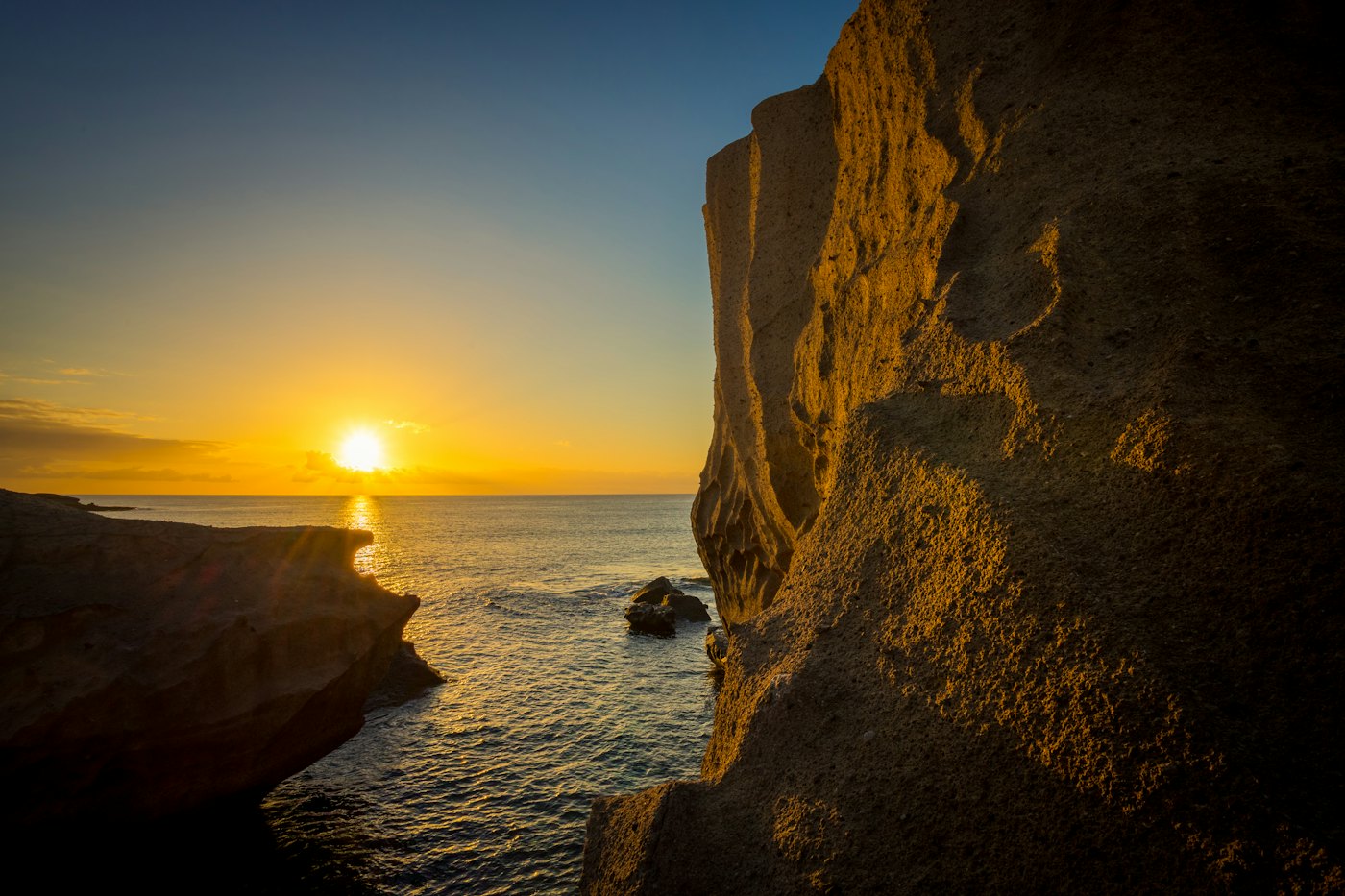 The sun setting over the Atlantic, seen from a clifftop
